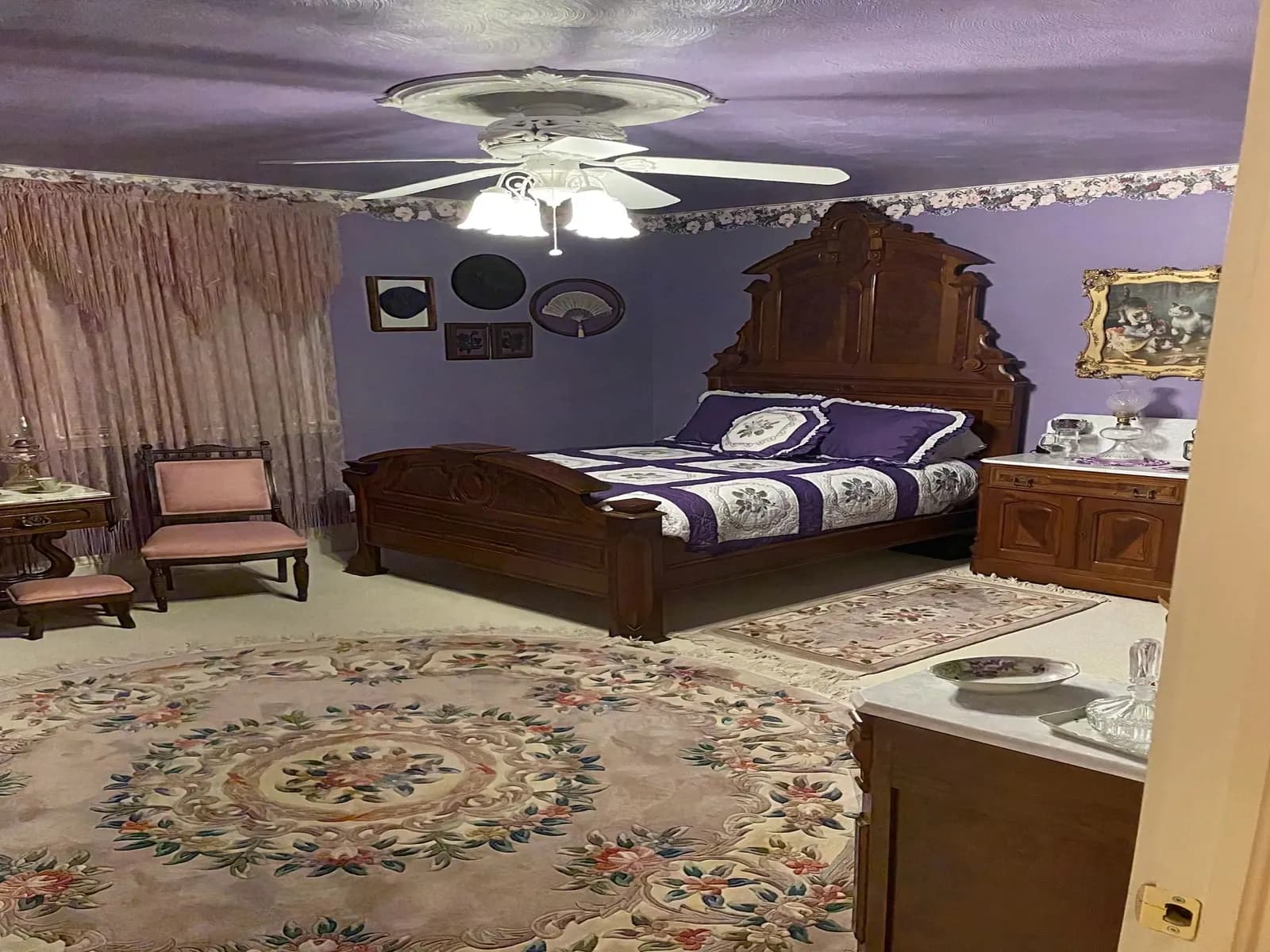 Bedroom with lavender walls and a white ceiling