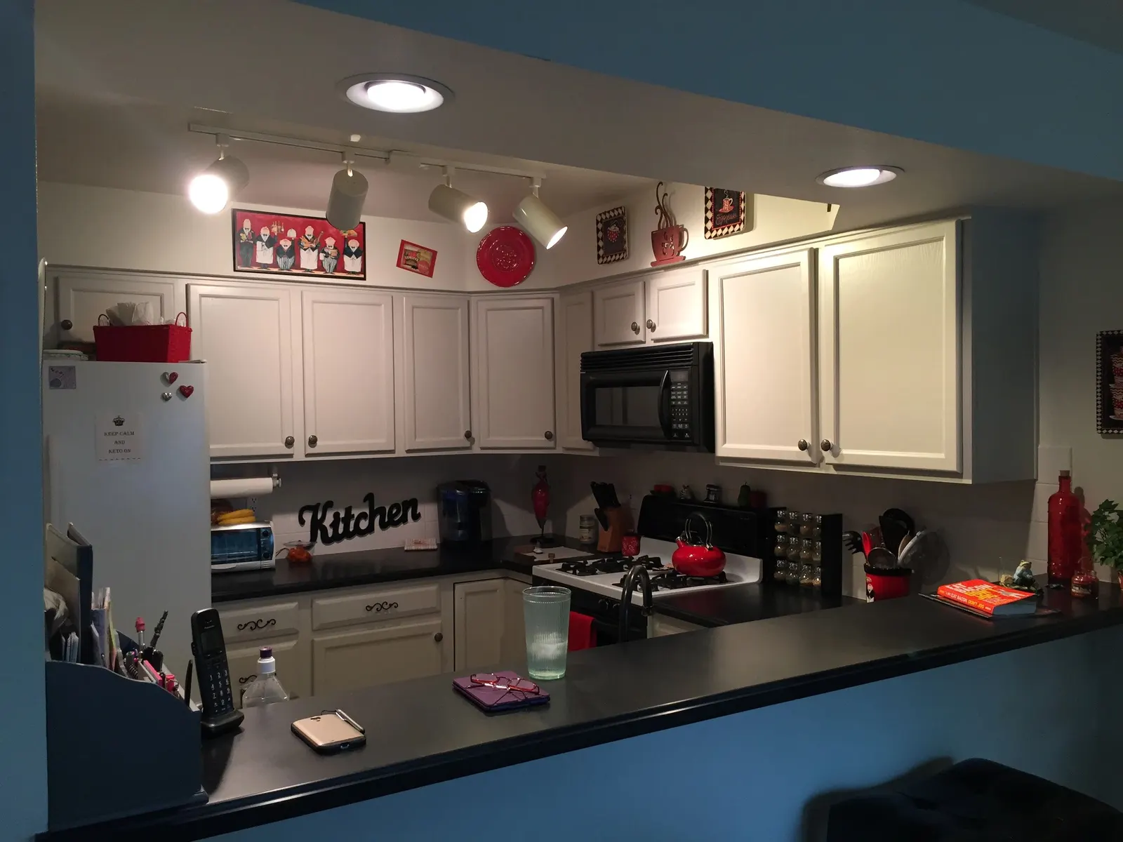 Kitchen with white cabinetry and freshly painted walls
